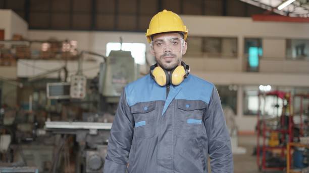istock Professional industrial engineer or technician have confidence, vision and leadership have expertise in engineering, wear personal protective equipment, standing in metal manufacturing factory, look at the camera. 1372708076
