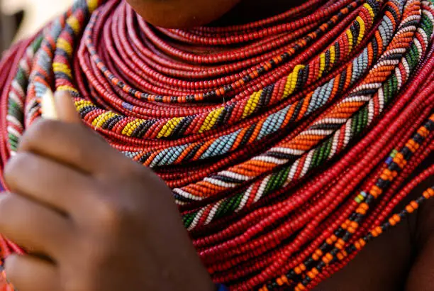 Bright (mainly red) beads are layered in many strands to form the necklace of a Samburu girl in Northern Kenya.