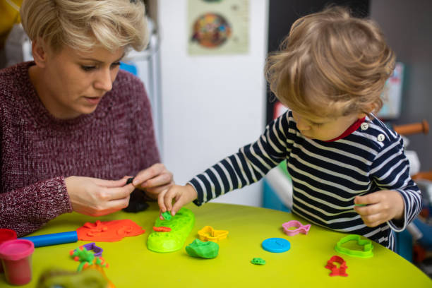 istock Cute mother and kid boy playing together 1372709826