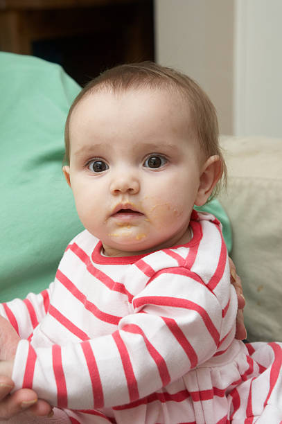 istock Bright eyed one year old girl looking 137271002