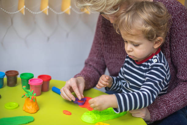 istock Cute mother and kid boy playing together 1372710243