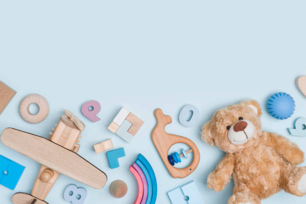 Children educational toy blocks on blue background with copy space