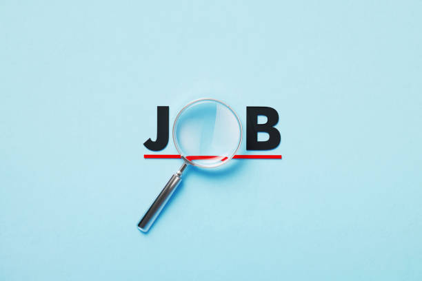 istock Magnifier Forming Job Word On Blue Background 1372716151