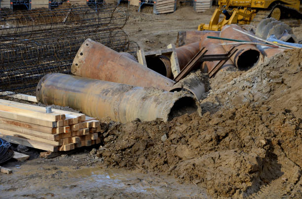 istock the drilling rig with a pipe drill drills holes for concreting the foundation columns and grouting the subsoil. wire reinforcing mesh cylinder shape, ready for installation on site, wrapped, trunk 1372720014