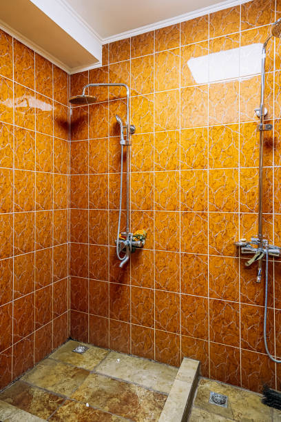 istock cheap room. shower in the bathroom 1372720135
