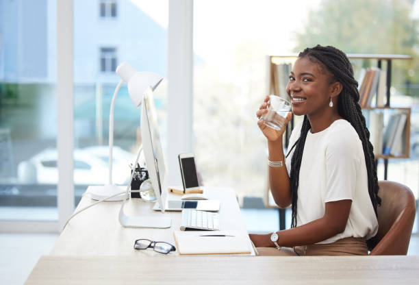 Shot of a young businesswoman using a computer in an office at work