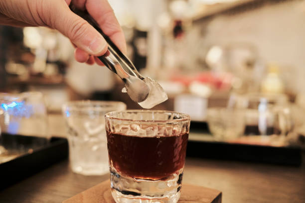 istock adding ice to a cup of pour-over coffee 1372723341
