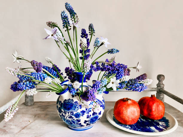 Romantic bouquet with muscari and pomegranate on a coffee table