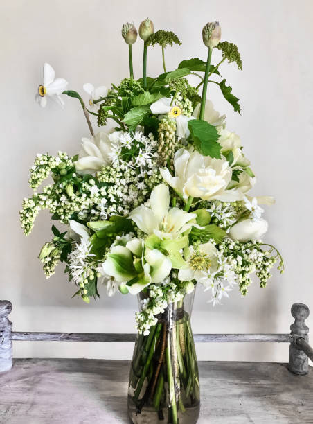 istock Romantic bouquet of white flowers on a coffee table 1372723438