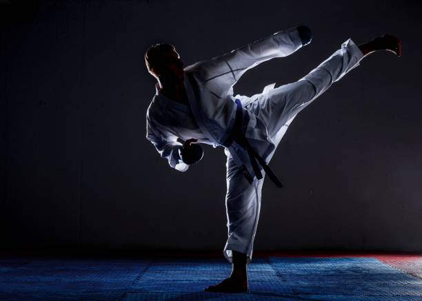 istock One karate kata training man isolated on dark background 1372723801
