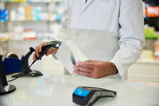 a hand is scanning with a code bar with a bar code reader. - bar code reader wireless technology computer equipment imagens e fotografias de stock