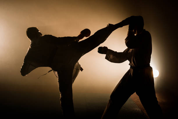 istock Professional karate fighter kicking. Isolated on a white background 1372727121