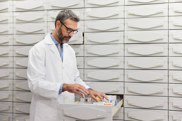 istock A pharmacist storing drugs in the storage room 1372727207