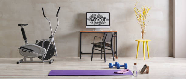 istock Sportive and training room style with purple mat dumbbell, computer background. 1372728924