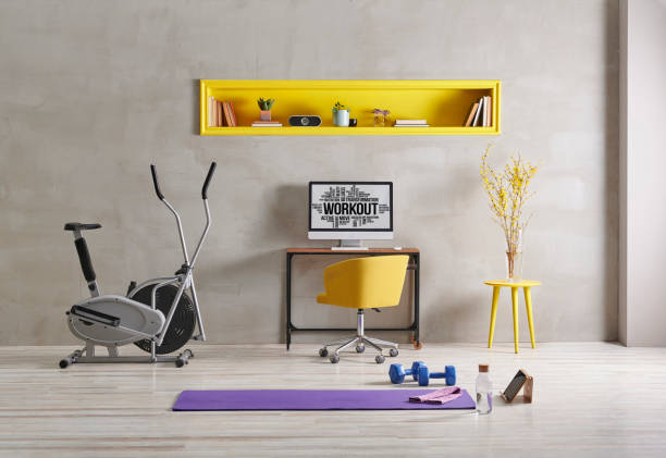 istock Sportive and training room style with purple mat dumbbell, computer background.Yellow bookshelf shelf book flower i pad laptop computer 1372729050