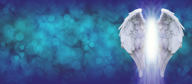 istock Angel Wings blue bokeh wide message background 1372729240