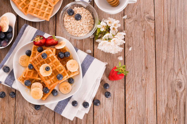 istock Waffles with blueberries, bananas and honey. 1372732735