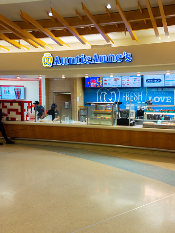 Orlando, Florida - February 4, 2022: Wide View of Auntie Anne's Shop inside Terminal B of Orlando International Airport