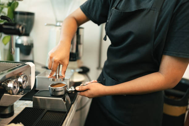 istock Woman barista cafe coffee uniform apron make coffee 1372735191