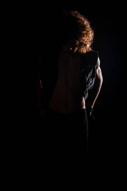 istock Young man with curly afro hair 1372736570