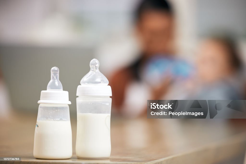A defocused shot of a mother feeding her baby boy at home My purpose is to just be good to you Infant Formula Stock Photo