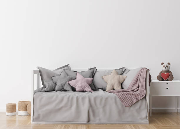 istock Empty white wall in modern child room. Mock up interior in scandinavian style. Free, copy space for your picture, poster. Bed, rattan baskets, toy. Cozy room for kids. 3D rendering. 1372738034