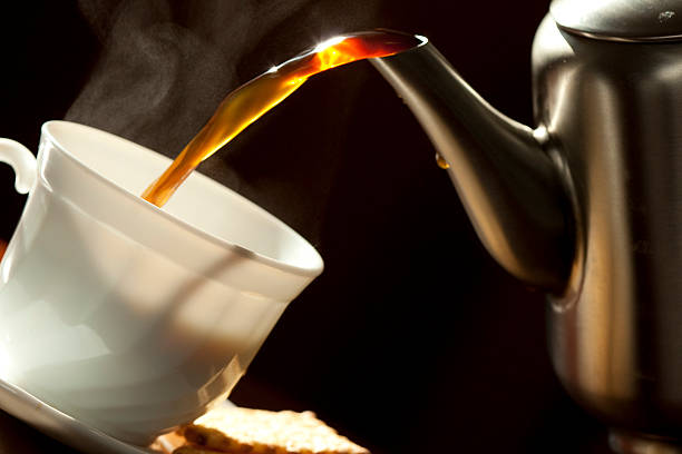 istock Pouring coffee into the white cup . Close-up. 137273970