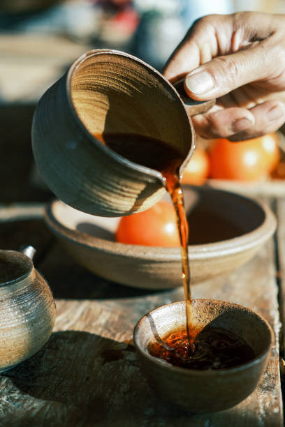 istock Pour tea with a teapot in hand 1372740606
