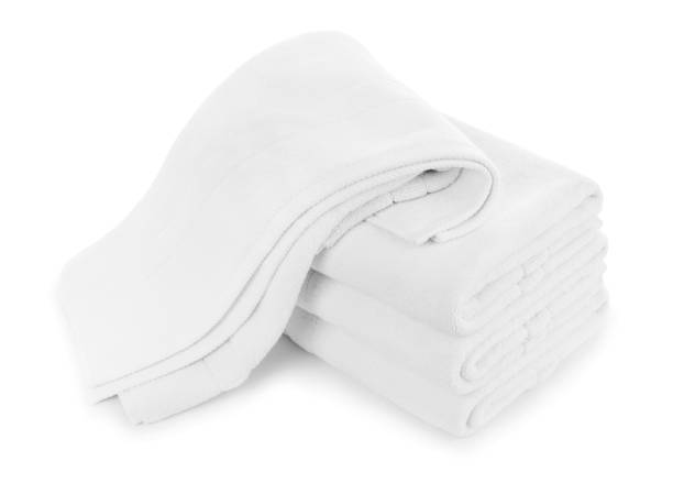 istock Stack of folded white cotton towels with one dropped on top 1372741873