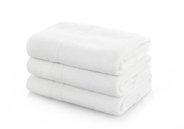 istock Stack of folded white cotton towels on white background 1372741893