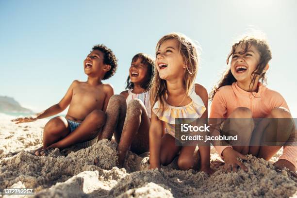Summer Fun At The Beach Stock Photo - Download Image Now - Child, Beach, Playing