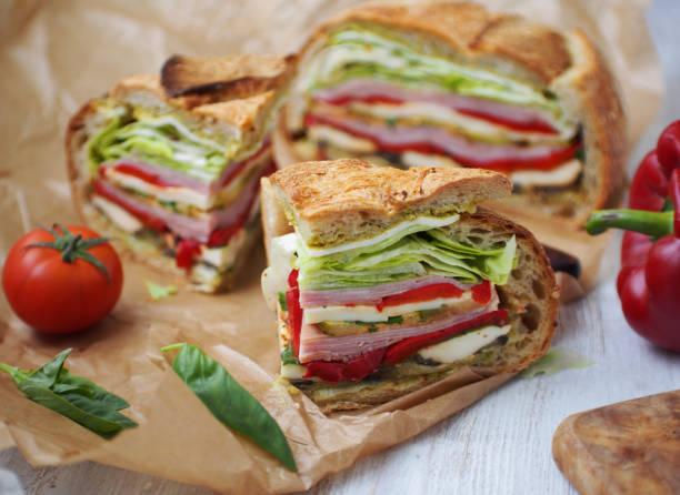 istock Mediterranean Pressed Picnic Sandwich with mozarella, grilled vegetables and ham 1372742584