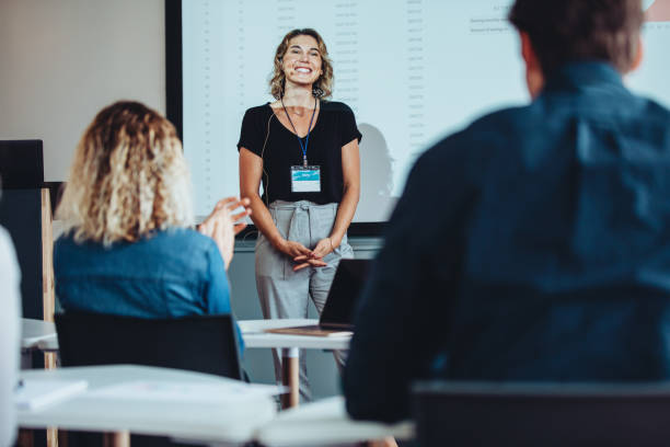 istock Conference audience applauding business speaker 1372744380
