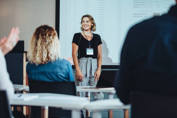 istock Businesswoman getting applause from the audience 1372744480