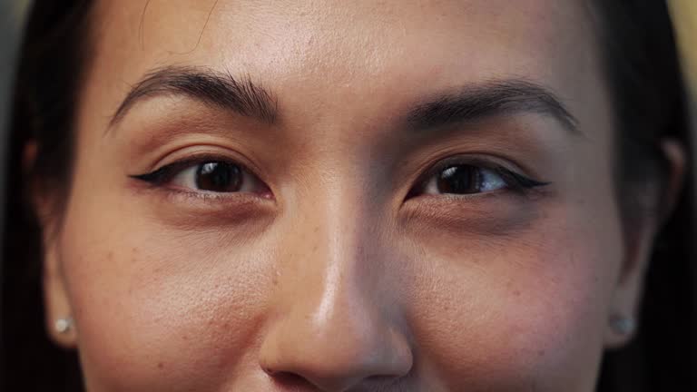 Eyes of different races representatives looking into camera