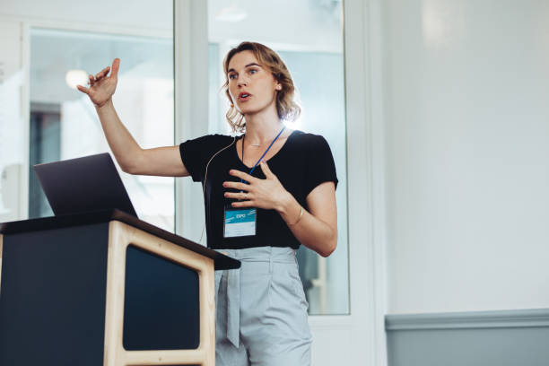 istock Businesswoman speaking from a podium 1372745209