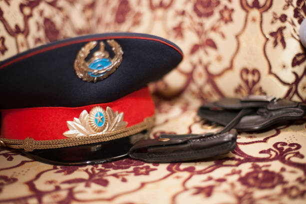 istock policeman's cap. gun and police uniform 1372745592