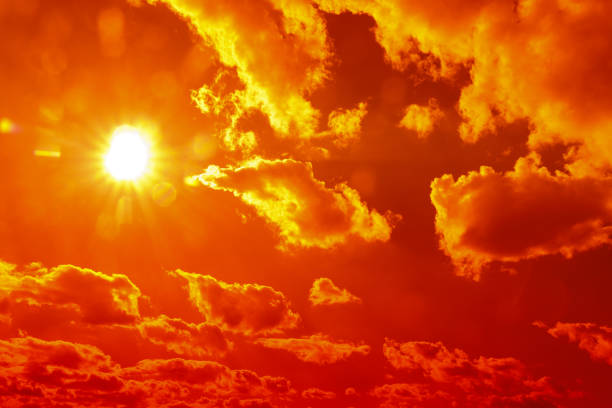 istock orange sky Clouds moving away rolling colorful sunset light dramatic clouds 1372745778