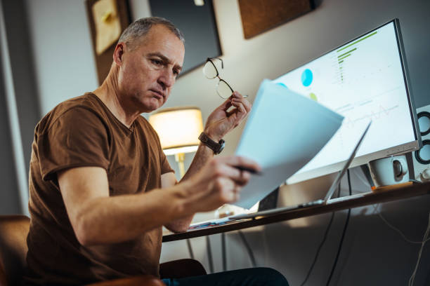 istock Keeping a close eye on his monthly finances 1372746108