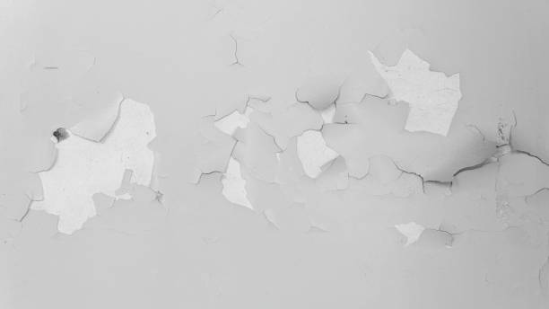 istock rough white concrete surface background. old plaster. cracks on the wall 1372748790