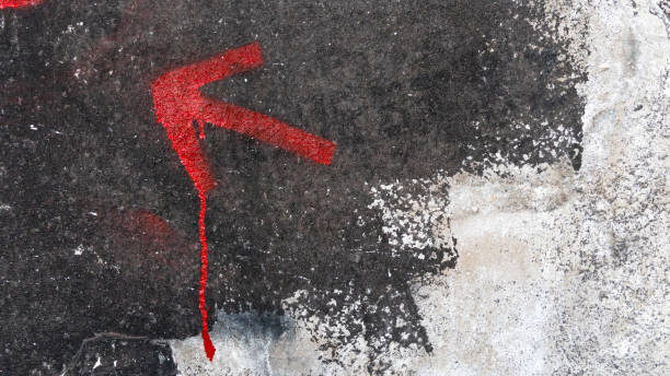 istock drawn arrow on the old wall in the cracks. old plaster. cracks on the wall 1372748924