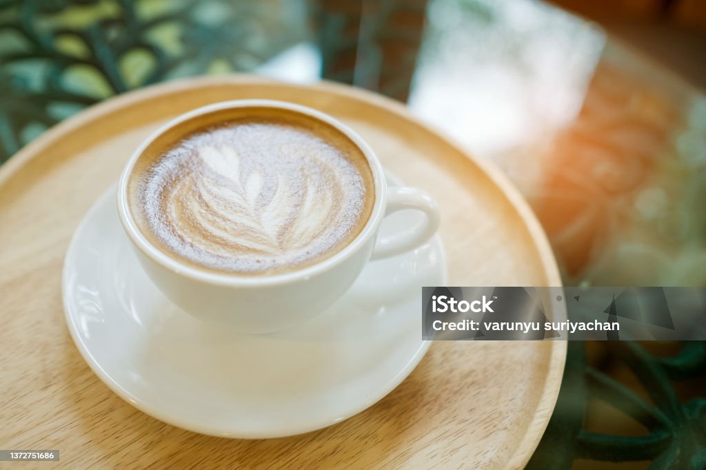 hot latte art coffee on table, relax time Caramel Stock Photo