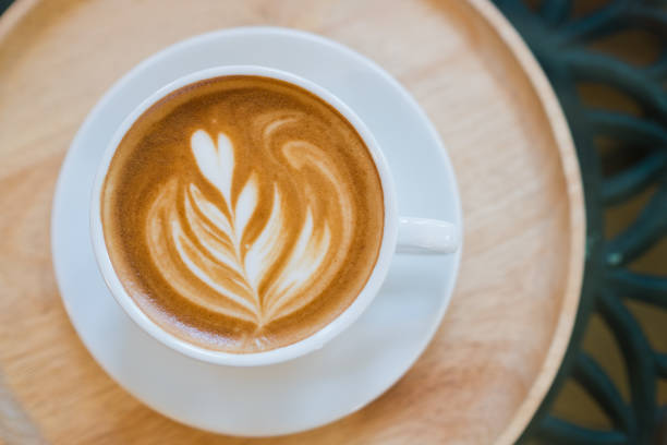 istock hot latte art coffee on table, relax time 1372751688
