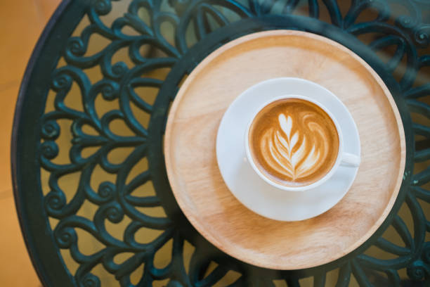 istock hot latte art coffee on table, relax time 1372751690