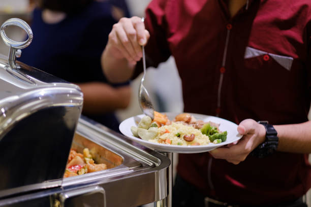 istock scooping the food, catering, dinner time 1372751718
