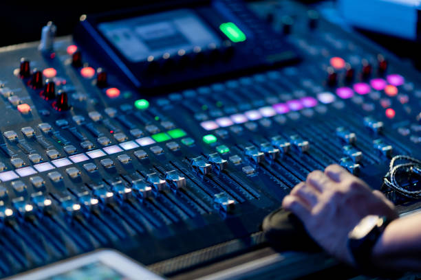 istock sound check for concert, mixer control, music engineer, backstage 1372755303