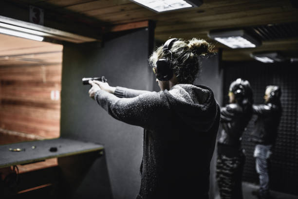 istock Friends Testing Their Firearm Skills On Gun Range 1372758252