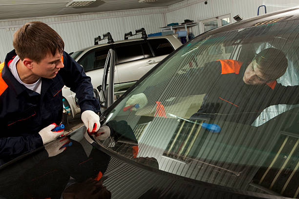 istock Two Real Mechanics working  in Auto Repair Shop. 137275840