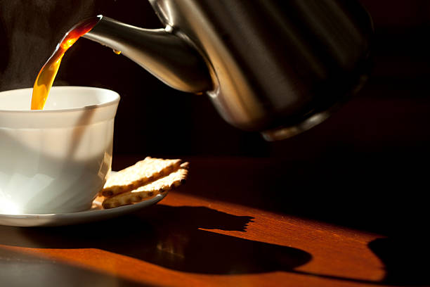 istock Pouring coffee into the white cup . Close-up. 137275885