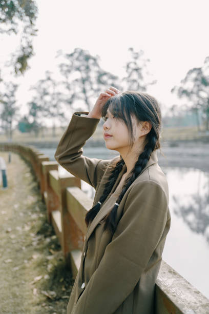 istock Young Asia on the bridge 1372758884